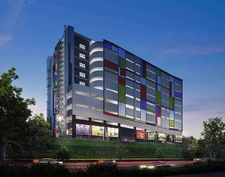 CT FoodNEX illuminated façade at dusk
