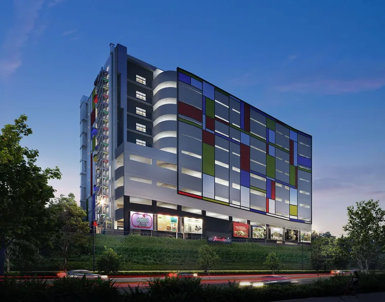 CT FoodNEX illuminated façade at dusk